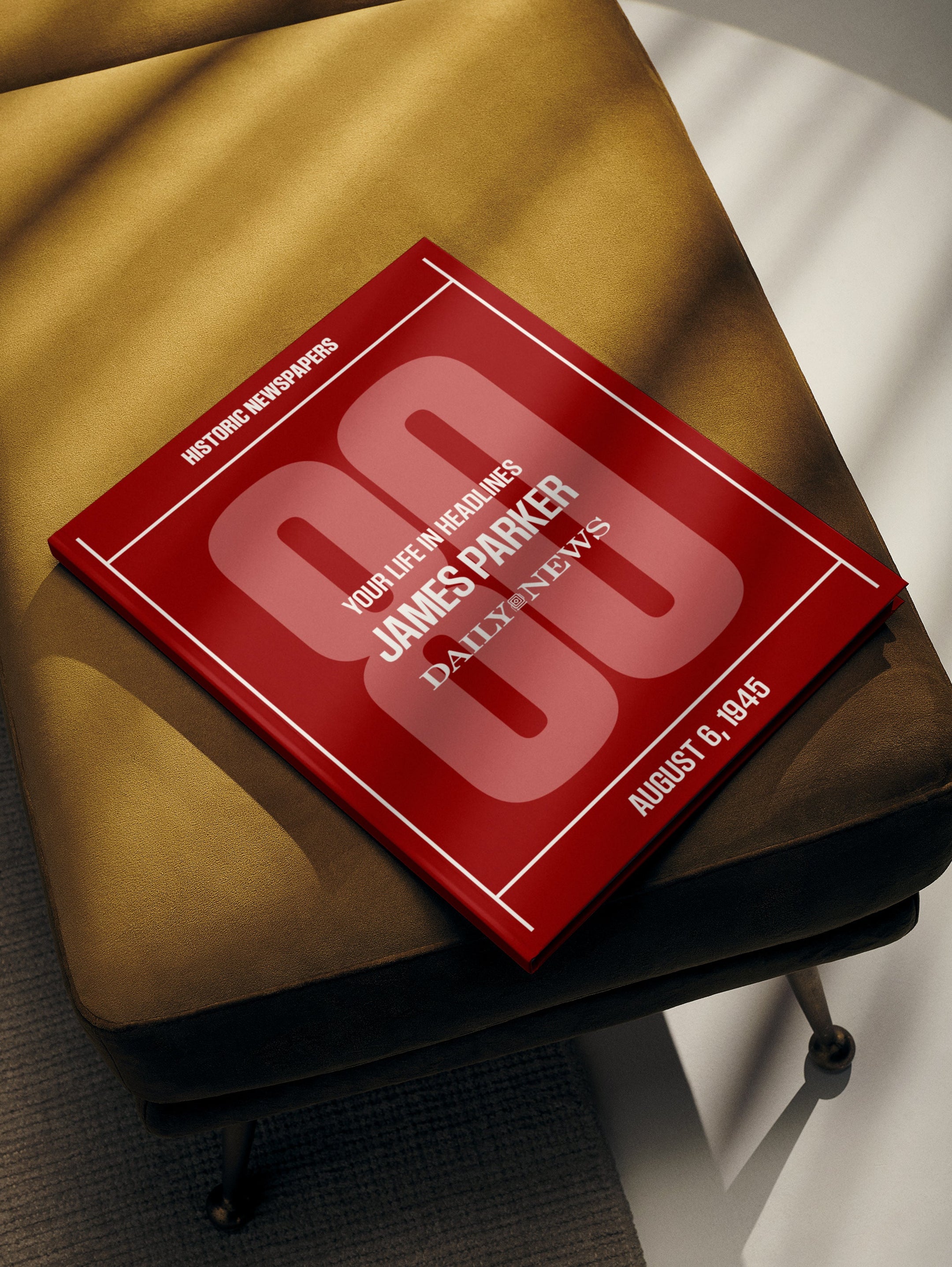 Personalised birthday newspaper book featuring a New York Daily News edition in maroon cover, celebrating a milestone birthday.